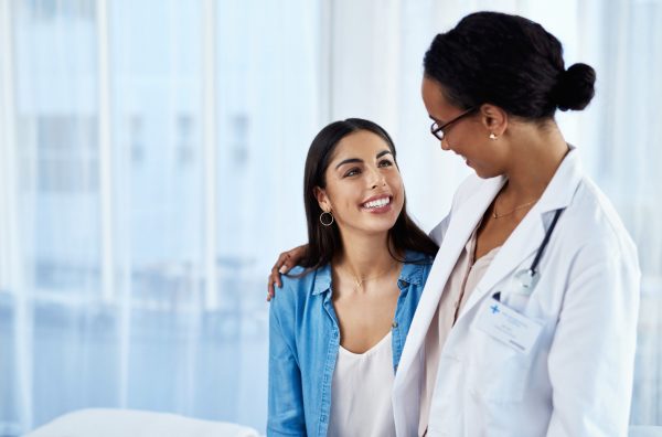 Young woman has conversation with doctor